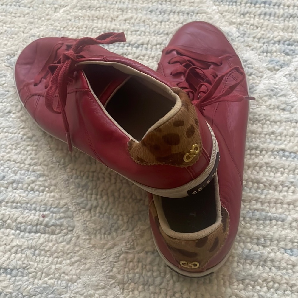 Cole Haan red leather sneakers with leopard detail
